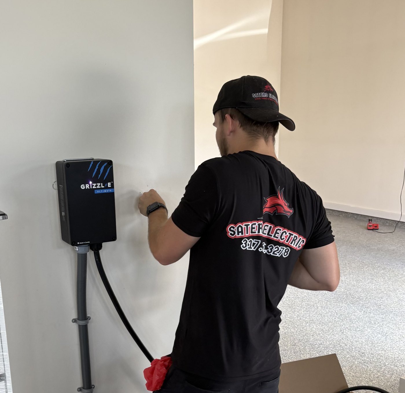 Saters Electric technician installing a home EV charger