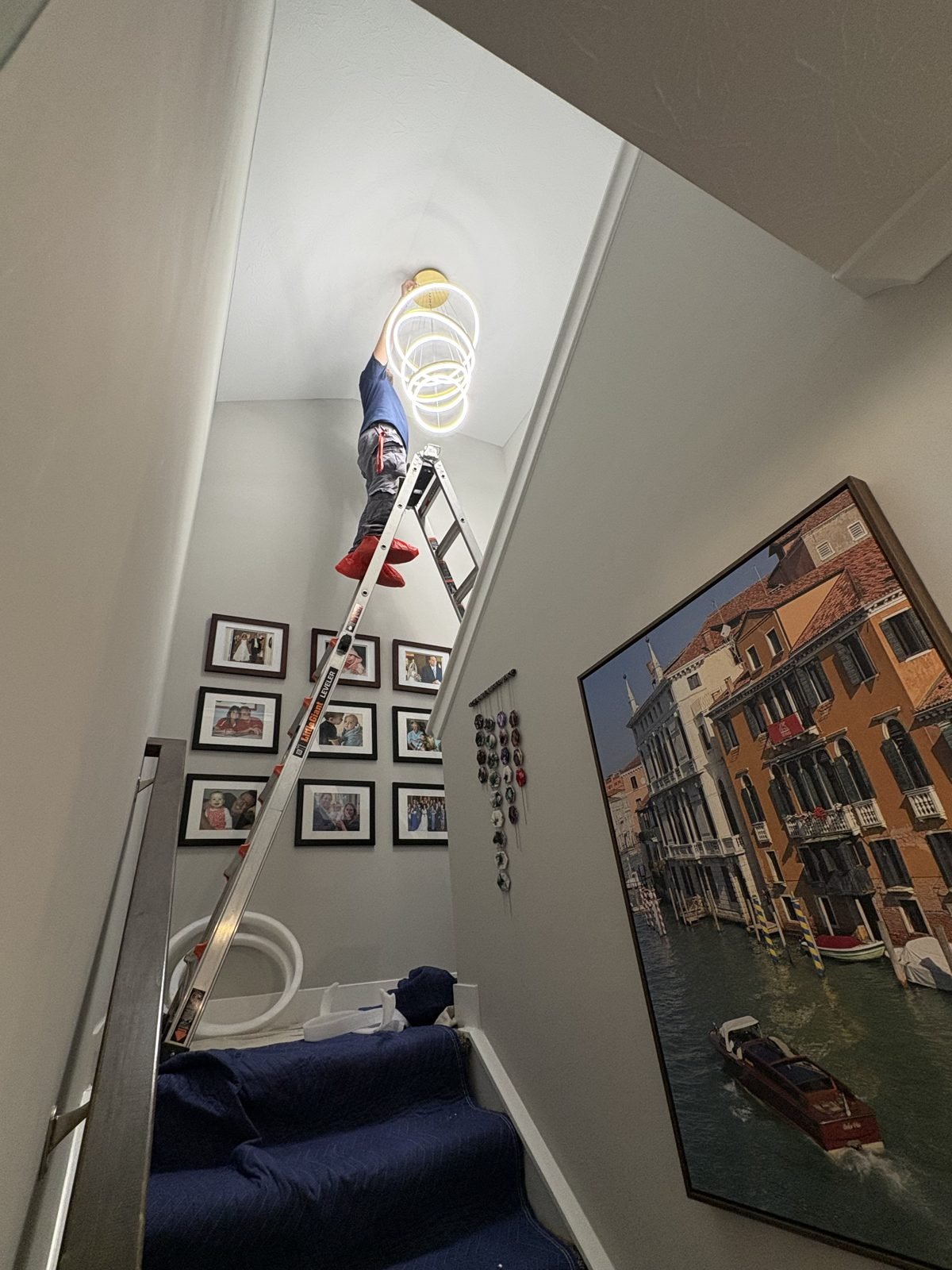 Stairwell LED chandelier install by Saters Electric