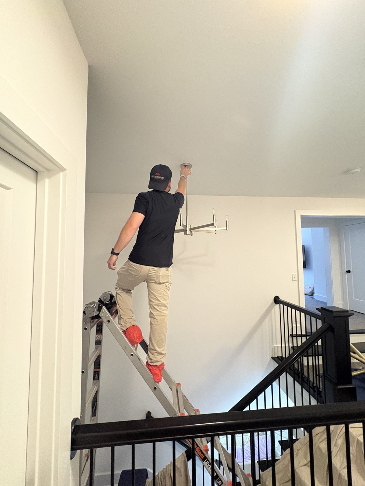 Stairwell light install by Saters Electric